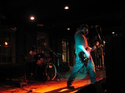 Winter Itch, a band I had in New Hampshire playing a show at Milly's Tavern in Manchester in 2008. I'm in the foreground on guitar. Glen on drums, Chris on bass (kinda obscured by me in this shot). 