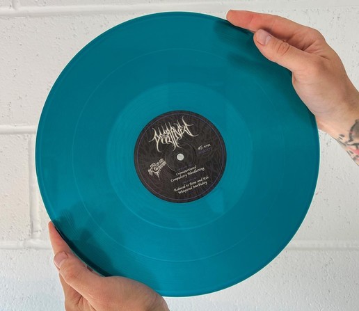The stock photo of the blue/teal vinyl version of Degraved's EP from last year, Whispered Morbidity. 