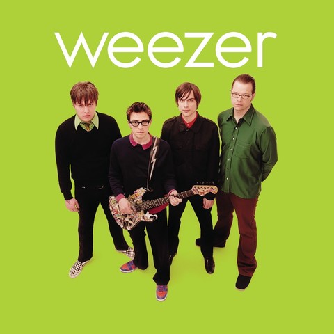 The cover of Weezer's green album. The band is standing centrally on an all lime green background. Band name in white font above them. In order: Mikey (RIP), Rivers, Brian, Pat. 