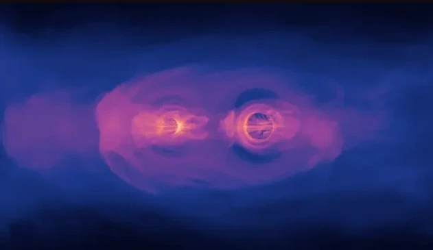This still from a NASA simulation shows the glow from two supermassive black holes as they spiral toward each other ahead of a collision. (Image credit: NASA's Goddard Space Flight Center) 