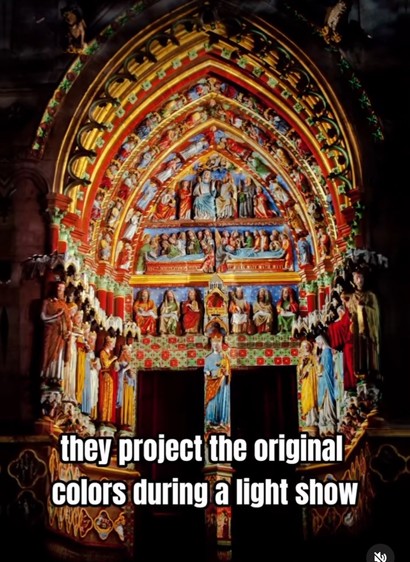 A vibrant, illuminated cathedral facade with intricate religious sculptures and arches, captioned, "they project the original colors during a light show."