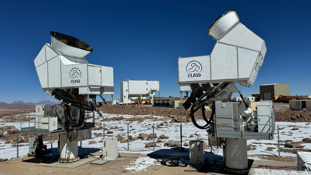 CLASS telescopes can detect cosmic microwave light signals from the 'cosmic dawn'. Image of two telescopes, a blue sky, and the research facility by: Deniz Valle and Jullianna Couto