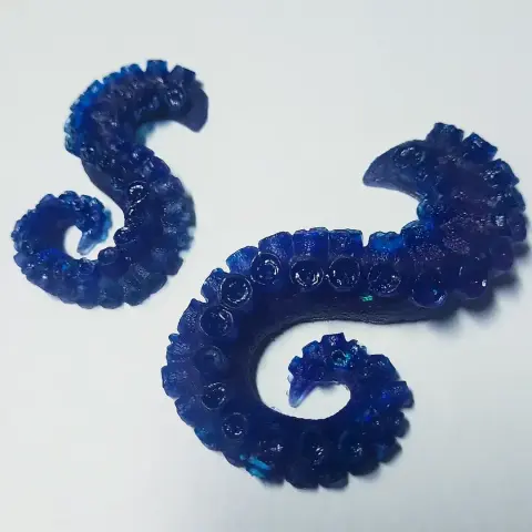 Two translucent blue resin tentacles my wife made from resin